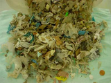 Plastic, wood and shredded waste prior to comminution